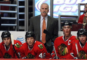 CHICAGO - OCTOBER 21: Head coach Joel Quenneville of the Chicago Blackhawks watches as his team takes on the Vancouver Canucks at the United Center on October 14, 2009 in Chicago, Illinois. The Canucks defeated the Blackhawks 3-2. (Photo by Jonathan Daniel/Getty Images)