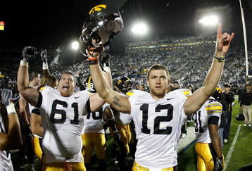 STATE COLLEGE, PA - SEPTEMBER 26:  Ricky Stanzi #12 of the Iowa Hawkeyes celebrates a 21-10 victory over the Penn State Nittnay Lions with Travis Meade #61 on September 26, 2009 at Beaver Stadium in State College, Pennsylvania.  (Photo by Gregory Shamus/Getty Images)