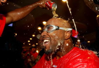 PHILADELPHIA - OCTOBER 21:  Jimmy Rollins #11 of the Philadelphia Phillies is sprayed down with champagne as they celebrate defeating the Los Angeles Dodgers 10-4 to advance to the World Series in Game Five of the NLCS during the 2009 MLB Playoffs at Citizens Bank Park on October 21, 2009 in Philadelphia, Pennsylvania.  (Photo by Nick Laham/Getty Images)