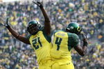 EUGENE, OR - OCTOBER 13:  Jaison Williams #4 of the Oregon Ducks celebrates with Garren Strong #21 after scoring a touchdown against the Washington State Cougars at Autzen Stadium October 13, 2007 in Eugene, Oregon.  (Photo by Jonathan Ferrey/Getty Images)