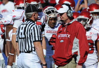GAINESVILLE, FL - OCTOBER 17: Coach Bobby Petrino of the Arkansas Razorbacks talks with SEC head linesman W. Randall Kizer during play against the Florida Gators October 17, 2009 at Ben Hill Griffin Stadium in Gainesville, Florida.  (Photo by Al Messerschmidt/Getty Images)