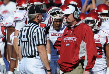 GAINESVILLE, FL - OCTOBER 17: Coach Bobby Petrino of the Arkansas Razorbacks talks with SEC head linesman W. Randall Kizer during play against the Florida Gators October 17, 2009 at Ben Hill Griffin Stadium in Gainesville, Florida.  (Photo by Al Messerschmidt/Getty Images)