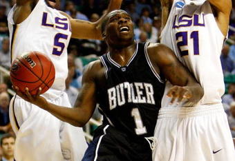 GREENSBORO, NC - MARCH 19:  Shelvin Mack #1 of the Butler Bulldogs drives to the basket between Marcus Thornton #5 and Chris Johnson #21 of the Louisiana State University Tigers during the first round of the NCAA Division I Men's Basketball Tournament at the Greensboro Coliseum on March 19, 2009 in Greensboro, North Carolina.  (Photo by Streeter Lecka/Getty Images)