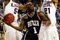 GREENSBORO, NC - MARCH 19:  Shelvin Mack #1 of the Butler Bulldogs drives to the basket between Marcus Thornton #5 and Chris Johnson #21 of the Louisiana State University Tigers during the first round of the NCAA Division I Men's Basketball Tournament at the Greensboro Coliseum on March 19, 2009 in Greensboro, North Carolina.  (Photo by Streeter Lecka/Getty Images)