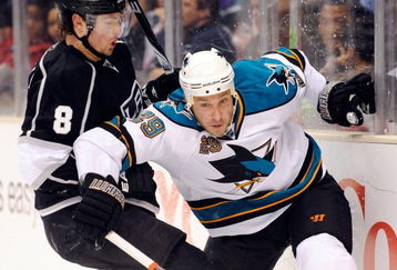 LOS ANGELES, CA - OCTOBER 06:  Ryane Clowe #29 of the San Jose Sharks moves for the puck against Drew Doughty #8 of the Los Angeles Kings during the NHL hockey game on October 6, 2009 in Los Angeles, California. Kings won, 6-4.  (Photo by Kevork Djansezian/Getty Images)