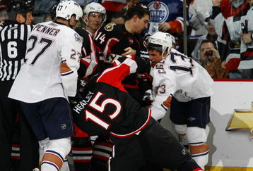 OTTAWA - MARCH 5:  Dustin Penner #27 of the Edmonton Oilers pulls Dany Heatley #15 of the Ottawa Senators off his skates during a melee late in the third period of a game on March 5, 2009 at the Scotiabank Place in Ottawa, Canada. The Ottawa Senators defeated the Edmonton Oilers 4-2. (Photo by Phillip MacCallum/Getty Images)