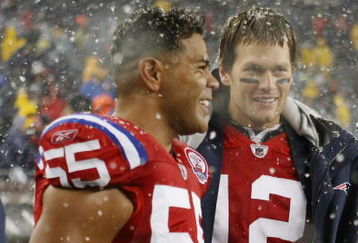 FOXBORO, MA - OCTOBER 18:  Tom Brady #12 and Junior Seau #55 of the New England Patriots stand on the sideline in the fourth quarter against the Tennessee Titans on October 18, 2009 at Gillette Stadium in Foxboro, Massachusetts. The Patriots defeated the Titans 59-0.  (Photo by Elsa/Getty Images)