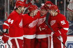 DETROIT - OCTOBER 10:  Jason Williams #29 of the Detroit Red Wings celebrates a second period goal with Nicklas Lidstrom #5, Valtteri Filppula #51 and Todd Bertuzzi #44 while playing the Washington Capitals on October 10, 2009 at Joe Louis Arena in Detroit, Michigan.  (Photo by Gregory Shamus/Getty Images)
