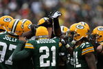 GREEN BAY, WI - NOVEMBER 30:  (L-R) Johnny Jolly #97, Charles Woodson #21 and Al Harris #31 of the Green Bay Packers huddle up with their defensive teammates against the Carolina Panthers at Lambeau Field on November 30, 2008 in Green Bay, Wisconsin. The Panthers won 35-31.  (Photo by Jonathan Daniel/Getty Images)