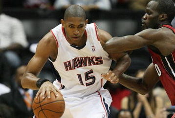 ATLANTA - MAY 03:  Al Horford #15 of the Atlanta Hawks backs down Joel Anthony #50 of the Miami Heat during Game Seven of the Eastern Conference Quarterfinals at Philips Arena on May 3, 2009 in Atlanta, Georgia. The Hawks defeated the Heat 91-78. NOTE TO USER: User expressly acknowledges and agrees that, by downloading and/or using this Photograph, user is consenting to the terms and conditions of the Getty Images License Agreement.  (Photo by Doug Benc/Getty Images)