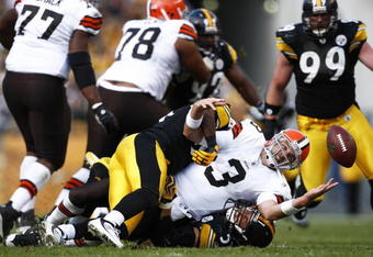 PITTSBURGH, PA - OCTOBER 18: Derek Anderson #3 of the Cleveland Browns fumbles the football after being sacked by James Farrior #51 of the Pittsburgh Steelers at Heinz Field on October 18, 2009 in Pittsburgh, Pennsylvania. The Steelers defeated the Browns 27-14. (Photo by Joe Robbins/Getty Images)