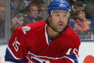 TORONTO, ON - OCTOBER 1:  Glen Metropolit #15 of the Montreal Canadiens skates after a loose puck in a game against the Toronto Maple Leafs on October 1, 2009 at the Air Canada Centre in Toronto, Ontario. The Canadiens dfeated the Leafs 4-3 in overtime. (Photo by Claus Andersen/Getty Images)