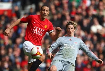 MANCHESTER, UNITED KINGDOM - MARCH 14:  Fernando Torres of Liverpool competes for the balll with Rio Ferdinand of Manchester United during the Barclays Premier League match between Manchester United and Liverpool at Old Trafford on March 14, 2009 in Manchester, England.  (Photo by Laurence Griffiths/Getty Images)