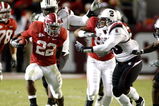 TUSCALOOSA - OCTOBER 17:  Running back Mark Ingram #22 of the Alabama Crimson Tide breaks through the line of scrimmage on a running play during the game against the South Carolina Gamecocks at Bryant-Denny Stadium on October 17, 2009 in Tuscaloosa, Alabama.  The Crimson Tide beat the Gamecocks 20-6.  (Photo by Mike Zarrilli/Getty Images)