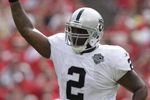 KANSAS CITY, MO - SEPTEMBER 20:  JaMarcus Russell #2 of the Oakland Raiders points to the sky in celebration during the game against the Kansas City Chiefs at Arrowhead Stadium on September 20, 2009 in Kansas City, Missouri. (Photo by Jamie Squire/Getty Images)