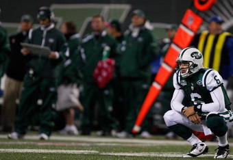 EAST RUTHERFORD, NJ - OCTOBER 18: Mark Sanchez #6 of the New York Jets crouches to the ground after throwing an interception against the Buffalo Bills during the game on October 18, 2009 at Giants Stadium in East Rutherford, New Jersey. The Bills defeated the Jets 16-13 in overtime. (Photo by Jared Wickerham/Getty Images)