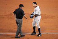 ANAHEIM, CA - OCTOBER 22:  Johnny Damon #18 of the New York Yankees argues a call with first base umpire Dale Scott at the end of the third inning in Game Five of the ALCS against the Los Angeles Angels of Anaheim during the 2009 MLB Playoffs at Angel Stadium on October 22, 2009 in Anaheim, California.  (Photo by Harry How/Getty Images)