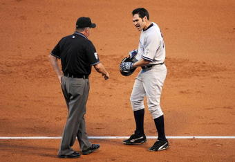 ANAHEIM, CA - OCTOBER 22:  Johnny Damon #18 of the New York Yankees argues a call with first base umpire Dale Scott at the end of the third inning in Game Five of the ALCS against the Los Angeles Angels of Anaheim during the 2009 MLB Playoffs at Angel Stadium on October 22, 2009 in Anaheim, California.  (Photo by Harry How/Getty Images)