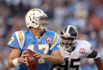 SAN DIEGO, CA - OCTOBER 19:  Quarterback Philip Rivers #17 of  the San Diego Chargers runs against the tackle of Darrell Reid #95 of the Denver Broncos during Monday Night Football on October 19, 2009 at Qualcomm Stadium in San Diego, California. (Photo by Donald Miralle/Getty Images)