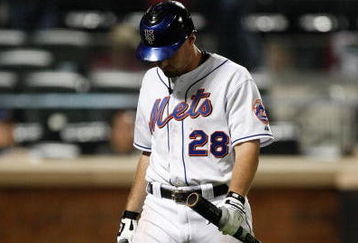 NEW YORK - SEPTEMBER 23:  Daniel Murphy #28 of the New York Mets walks to the dugout after striking out against the Atlanta Braves during the game on September 23, 2009 at Citi Field in the Flushing neighborhood of the Queens borough of New York City.  (Photo by Jared Wickerham/Getty Images)