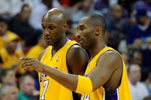 LAS VEGAS - OCTOBER 15:  Lamar Odom #7 and Kobe Bryant #24 of the Los Angeles Lakers walk to the bench during their preseason game against the Sacramento Kings at the Thomas & Mack Center October 15, 2009 in Las Vegas, Nevada. NOTE TO USER: User expressly acknowledges and agrees that, by downloading and/or using this Photograph, user is consenting to the terms and conditions of the Getty Images License Agreement.  (Photo by Ethan Miller/Getty Images)
