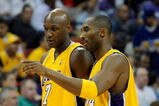 LAS VEGAS - OCTOBER 15:  Lamar Odom #7 and Kobe Bryant #24 of the Los Angeles Lakers walk to the bench during their preseason game against the Sacramento Kings at the Thomas & Mack Center October 15, 2009 in Las Vegas, Nevada. NOTE TO USER: User expressly acknowledges and agrees that, by downloading and/or using this Photograph, user is consenting to the terms and conditions of the Getty Images License Agreement.  (Photo by Ethan Miller/Getty Images)
