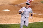 ANAHEIM, CA - OCTOBER 22:  Mark Teixeira #25 of the New York Yankees reacts after scoring on a Hideki Matsui #55 single during the seventh inning in Game Five of the ALCS against the Los Angeles Angels of Anaheim during the 2009 MLB Playoffs at Angel Stadium on October 22, 2009 in Anaheim, California.  (Photo by Harry How/Getty Images)