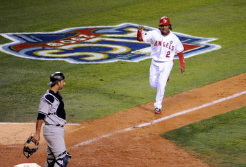 ANAHEIM, CA - OCTOBER 22:  Erick Aybar #2 of the Los Angeles Angels of Anaheim reacts as he scores on Vladimir Guerrero #27 (Not Shown) singles in the seventh inning in Game Five of the ALCS against the New York Yankees during the 2009 MLB Playoffs at Angel Stadium on October 22, 2009 in Anaheim, California.  (Photo by Harry How/Getty Images)
