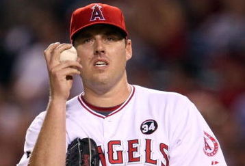 ANAHEIM, CA - OCTOBER 22:  John Lackey #41 of the Los Angeles Angels of Anaheim reacts in Game Five of the ALCS against the New York Yankees during the 2009 MLB Playoffs at Angel Stadium on October 22, 2009 in Anaheim, California.  (Photo by Stephen Dunn/Getty Images)