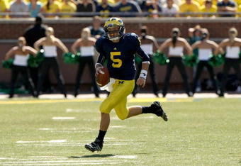ANN ARBOR, MI - SEPTEMBER 19:  Quarterback Tate Forcier #5 of the Michigan Wolverines carries the ball against the Eastern Michigan Eagles at Michigan Stadium on September 19, 2009 in Ann Arbor, Michigan.   Michigan won 45-17.  (Photo by Stephen Dunn/Getty Images)