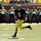 ANN ARBOR, MI - SEPTEMBER 19:  Quarterback Tate Forcier #5 of the Michigan Wolverines carries the ball against the Eastern Michigan Eagles at Michigan Stadium on September 19, 2009 in Ann Arbor, Michigan.   Michigan won 45-17.  (Photo by Stephen Dunn/Getty Images)