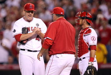 ANAHEIM, CA - OCTOBER 22:  John Lackey #41 of the Los Angeles Angels of Anaheim pleads with his Manager Mike Scioscia to stay in the game during the seventh inning in Game Five of the ALCS against the New York Yankees during the 2009 MLB Playoffs at Angel Stadium on October 22, 2009 in Anaheim, California.  (Photo by Stephen Dunn/Getty Images)