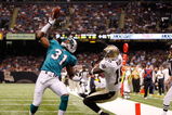 NEW ORLEANS - SEPTEMBER 03:  Sean Smith #31 of the Miami Dolphins makes an interception catch over Courtney Roby #15 of the New Orleans Saints at the Louisiana Superdome on September 3, 2009 in New Orleans, Louisiana.  (Photo by Chris Graythen/Getty Images)