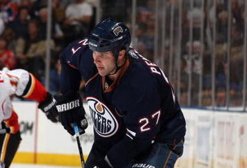 EDMONTON, CANADA - SEPTEMBER 23:  Dustin Penner #27 of the Edmonton Oilers skates with the puck against the Calgary Flames on September 23, 2009 at Rexall Place in Edmonton, Alberta, Canada. (Photo by Dale MacMillan/Getty Images)