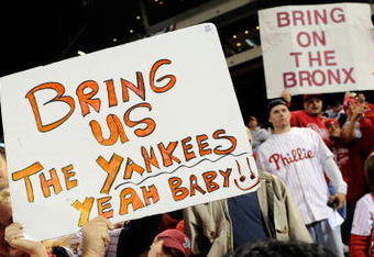 PHILADELPHIA - OCTOBER 21:  Fans of the Philadelphia Phillies hold up signs which call for the Phillies to play against the New York Yankees in the World Series after the Phillies advanced to the series with their 10-4 against the Los Angeles Dodgers in Game Five of the NLCS during the 2009 MLB Playoffs at Citizens Bank Park on October 21, 2009 in Philadelphia, Pennsylvania.  (Photo by Jeff Zelevansky/Getty Images)
