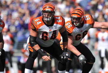 BALTIMORE - OCTOBER 11:  Kyle Cook #64 of the Cincinnati Bengals prepares to snap the ball during the game against the Baltimore Ravens at M&T Bank Stadium on October 11, 2009 in Baltimore, Maryland. The Bengals defeated the Ravens 17-14. (Photo by Larry French/Getty Images)