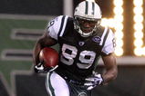 EAST RUTHERFORD, NJ - NOVEMBER 30:  Jerricho Cotchery #89 of the New York Jets runs the ball against the Denver Broncos on November 30, 2008 at Giants Stadium in East Rutherford, New Jersey.  (Photo by Jim McIsaac/Getty Images)