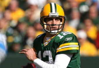 GREEN BAY, WI - OCTOBER 18: Aaron Rodgers #12 of the Green Bay Packers looks for a receiver during a game against the Detroit Lions at Lambeau Field on October 18, 2009 in Green Bay, Wisconsin. The Packers defeated the Lions 26-0. (Photo by Jonathan Daniel/Getty Images)