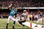NEW ORLEANS - SEPTEMBER 03:  Sean Smith #31 of the Miami Dolphins makes an interception catch over Courtney Roby #15 of the New Orleans Saints at the Louisiana Superdome on September 3, 2009 in New Orleans, Louisiana.  (Photo by Chris Graythen/Getty Images)