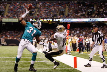NEW ORLEANS - SEPTEMBER 03:  Sean Smith #31 of the Miami Dolphins makes an interception catch over Courtney Roby #15 of the New Orleans Saints at the Louisiana Superdome on September 3, 2009 in New Orleans, Louisiana.  (Photo by Chris Graythen/Getty Images)