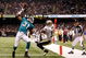 NEW ORLEANS - SEPTEMBER 03:  Sean Smith #31 of the Miami Dolphins makes an interception catch over Courtney Roby #15 of the New Orleans Saints at the Louisiana Superdome on September 3, 2009 in New Orleans, Louisiana.  (Photo by Chris Graythen/Getty Images)