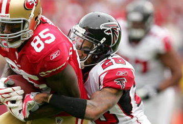 SAN FRANCISCO - OCTOBER 11:  Vernon Davis #85 ofthe San Francisco 49ers is tackled by Thomas DeCoud #28 of the Atlanta Falcons at Candlestick Park on October 11, 2009 in San Francisco, California.  (Photo by Ezra Shaw/Getty Images)