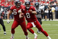 HOUSTON - SEPTEMBER 27:  Quarterback Matt Schaub #8 of the Houston Texans runs with the ball as guard Kasey Studdard #64 looks to block during the game against the Jacksonville Jaguars at Reliant Stadium on September 27, 2009 in Houston, Texas.  (Photo by Bob Levey/Getty Images)