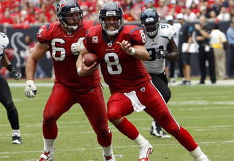 HOUSTON - SEPTEMBER 27:  Quarterback Matt Schaub #8 of the Houston Texans runs with the ball as guard Kasey Studdard #64 looks to block during the game against the Jacksonville Jaguars at Reliant Stadium on September 27, 2009 in Houston, Texas.  (Photo by Bob Levey/Getty Images)