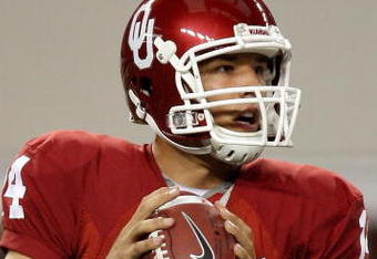ARLINGTON, TX - SEPTEMBER 05:  Quarterback Sam Bradford #14 of the Oklahoma Sooners drops back to pass against the Brigham Young Cougars at Cowboys Stadium on September 5, 2009 in Arlington, Texas.  (Photo by Ronald Martinez/Getty Images)