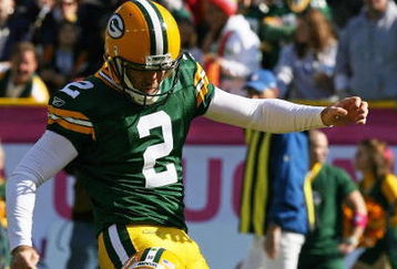 GREEN BAY, WI - OCTOBER 18: Mason Crosby #2 of the Green Bay Packers kicks a n extra point out of the hold of Matt Flynn #10 against the Detroit Lions rushes at Lambeau Field on October 18, 2009 in Green Bay, Wisconsin. The Packers defeated the Lions 26-0.  (Photo by Jonathan Daniel/Getty Images)
