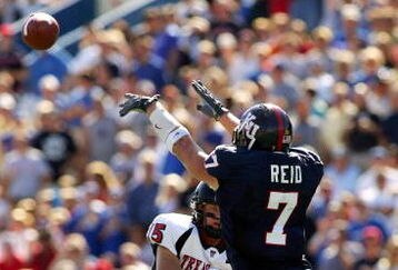 KANSAS CITY, MO - SEPTEMBER 25: Quarterback Sonnie Cumbie #15 of Texas Tech thows a pass against the defense Nick Reid #7 of University of Kansas at Memorial Stadium on September 25, 2004 in Kansas City, Missouri. (Photo by Donald Miralle/Getty Images)