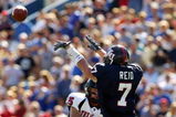 KANSAS CITY, MO - SEPTEMBER 25: Quarterback Sonnie Cumbie #15 of Texas Tech thows a pass against the defense Nick Reid #7 of University of Kansas at Memorial Stadium on September 25, 2004 in Kansas City, Missouri. (Photo by Donald Miralle/Getty Images)