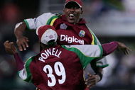 PORT ELIZABETH, SOUTH AFRICA - DECEMBER 16: Daren Powell of West Indies celebrates with Dwayne Bravo after running out Albie Morkel of South Africa during the Standard Bank International Pro20 match between South Africa and West Indies held at Sahara Oval December 16, 2007 in St Georges, Port Elizabeth, South Africa. (Photo by Duif du Toit/Gallo Images/Getty Images)