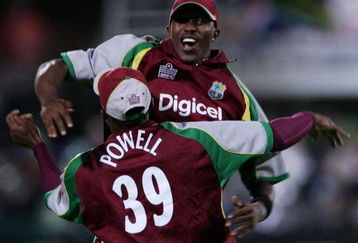 PORT ELIZABETH, SOUTH AFRICA - DECEMBER 16:  Daren Powell of West Indies celebrates with Dwayne Bravo after running out Albie Morkel of South Africa during the Standard Bank International Pro20 match between South Africa and West Indies held at Sahara Oval December 16, 2007 in St Georges, Port Elizabeth, South Africa. (Photo by Duif du Toit/Gallo Images/Getty Images)